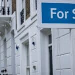 Estate agent 'for sale' sign on attractive London street