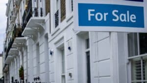 Estate agent 'for sale' sign on attractive London street