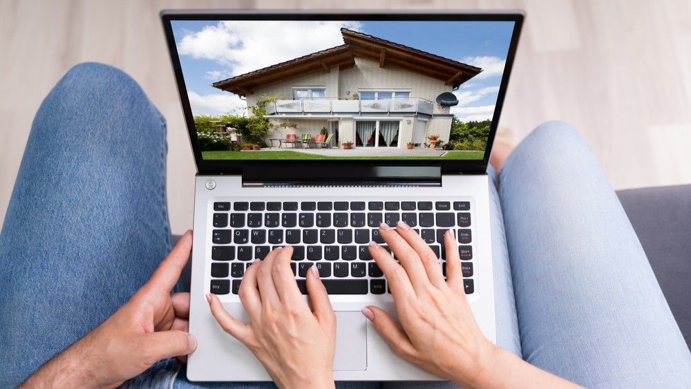 Couple Family Searching Real Estate Online On Laptop
