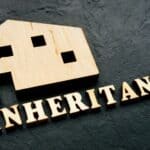 Wooden home as symbol of property and word inheritance.