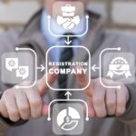 Man using virtual touch screen presses inscription: REGISTRATION COMPANY. New company registration concept. Business start up. Brand and identity building process. Company formation procedure.