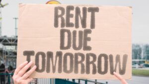 “Rent Due Tomorrow” The calendar nags louder than any alarm ever could. HOUSING. STRESS. DEADLINE. INFLATION. URGENCY. NIGHT.