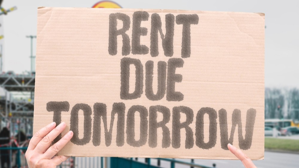 “Rent Due Tomorrow” The calendar nags louder than any alarm ever could. HOUSING. STRESS. DEADLINE. INFLATION. URGENCY. NIGHT.