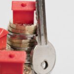 Housing cost. Red house with British currency