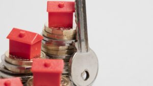 Housing cost. Red house with British currency